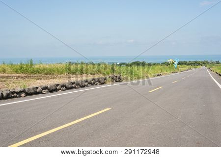 road at green paddy farm in the countryside
