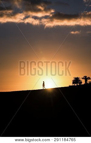 Maspalomas Dunes, Gran Canaria, Spain, Sunset With Shadow Silhouetes Of People In Front Of Sunball