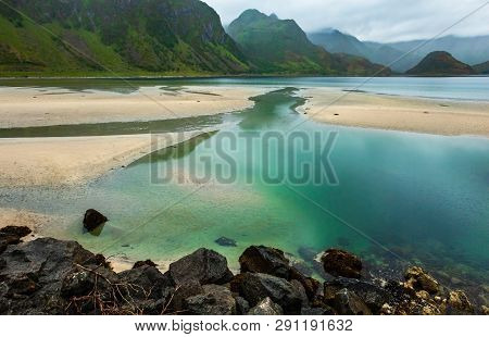 Lofoten Fjords And Lakes Cloudy Landscape With Sandy Beach, Lough, And Mountains (norway). Summer Po