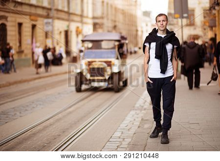Young Traveler Man Walk Alone By Old Europen Street