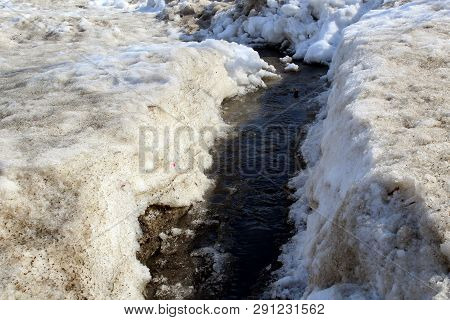 In The Spring Of Melting Snow Runs Murmuring Stream
