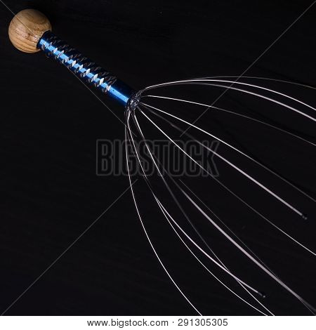 Device For Head Massage. Black Background. Orgasm. Relaxation.