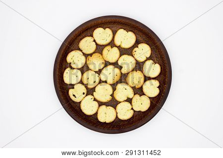Bake Rolls. The Mini Bread Chips On The Brown Bowl. Isolated On White Background.