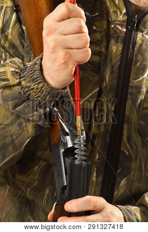 Hunter Maintenances The Barrels Of A Shotgun Using A Ramrod, Closeup