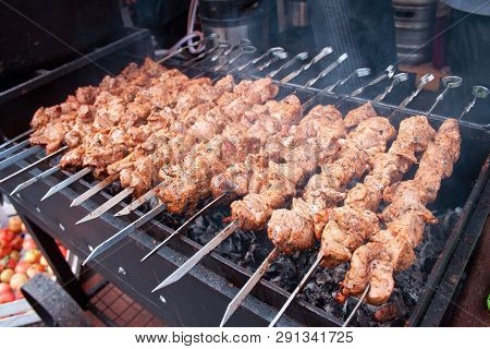 Close Up Of Some Meat Skewers, Grilled In A Barbecue, Shashlik Or Shashlyk Of Pork For A Pic Nic