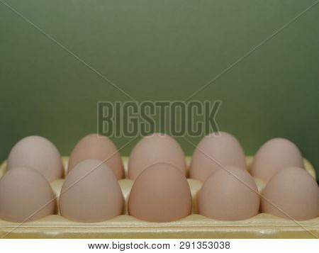 Chicken Eggs Lie In A Yellow Plastic Tray.
