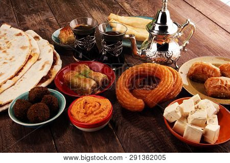 Middle Eastern Or Arabic Dishes And Assorted Meze, Concrete Rustic Background. Turkish Bread Or Turk