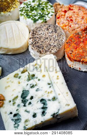 Assortment Of French Fresh White Soft Goat Cheeses With Different Tastes Topping Made With Herbs, Pa