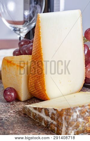 Marble Plate With Sheep Milk Cheeses Pur Brebis And Ossau-iraty From Pyrenees And Yellow Saint Pauli