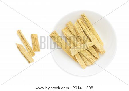 An Overhead Photo Of Dry Korean Soy Asparagus Isolated On White. Dry Tofu Skin Or Yuba, Bean Curd Sk