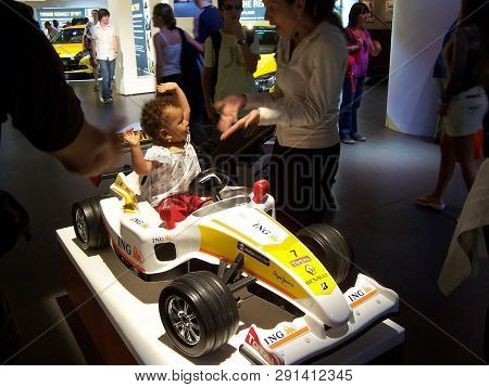 Paris, France-august 07, 2009: Little Black African American Girl Rejoices And Waves Her Hands Sitti