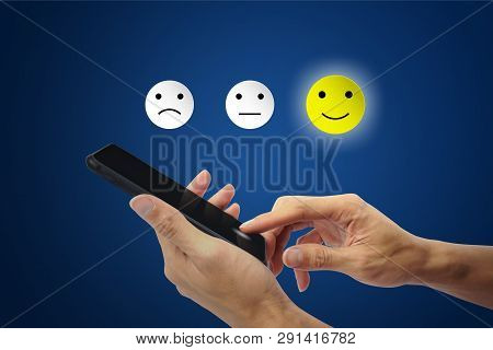 Conceptual The Customer Responded To The Survey. The Client Using Hand Choose Happy Face Smile Icon 