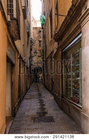 Barcelona, Spain - November 15, 2018: Perspective View Of The Narrow Street In The Gothic Quarter