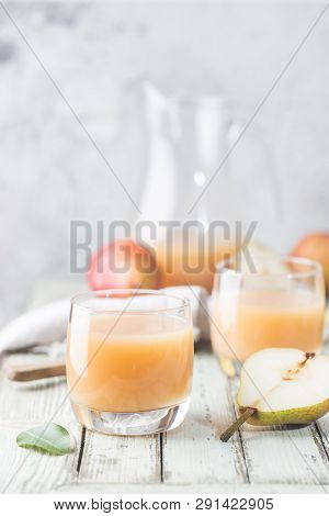 Fresh Pear Juice In A Glasses With Fresh Fruits On Light Background
