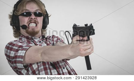 Nerd Geek Young Adult Man Playing On The Video Console Holding Gun Wearing Headphones With Microphon