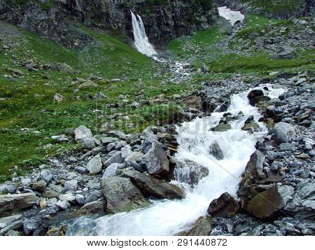 Nameless Waterfalls Under The Alpine Peaks Glarner Vorab And Bünder Vorab In The Valley Of Im Loch -