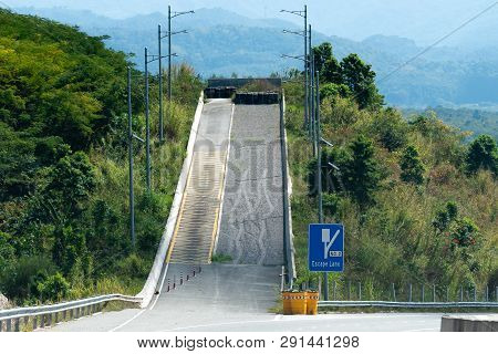 Escape Lane On Highway Through Mountains On Caribbean Island