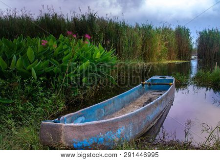 Old Wooden Boat Harbour On The Lakeside. Balinese Traditional Boat Known As Jukung On Batur Lake. Co