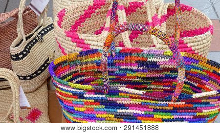 Colorful Handmade Handbags  Made With Paja Toquilla Straw At The Traditional Outdoor Market In Cuenc