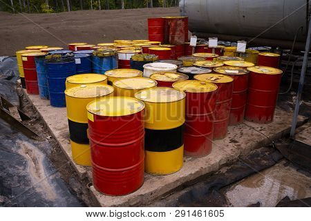 Colored Metal Barrels. Blue Oil Drums Containing Fuel For Transportation