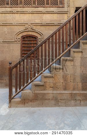Old Stone Bricks Wall  And, Window And Staircase With Wooden Balustrade