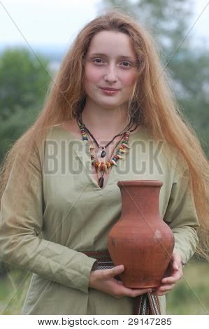 KIEV, UKRAINE - JULY 31: Member of history club Golden Capricorn wears medieval costume as she participates in historical festival and camp in memory of King Vladimir July 31, 2009 in Kiev, Ukraine.