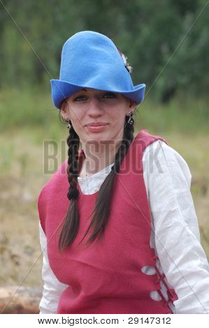 KIEV, UKRAINE - JULY 31: Member of history club Golden Capricorn wears medieval costume as she participates in historical festival and camp in memory of King Vladimir July 31, 2009 in Kiev, Ukraine.