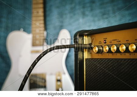 Guitar Electric Amplifier. Rock Overdrive Effect. Cable Plugged Into Amp Jack. Max Volume Control Kn