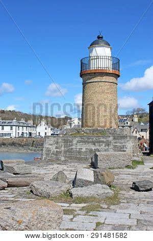 Portpatrick Lighthouse And Village In Galloway, Scotland