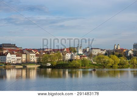 View at island of Tears memorial, Traetskae Pradmestse (Trinity Suburb) and upper town in Minsk, Belarus. Minsk cityscape in spring, Belarus.