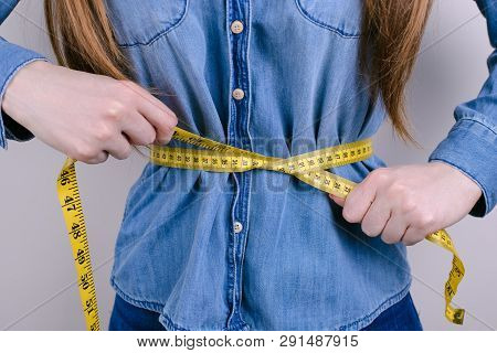 Bmi Size Scale Famine Starvation  Concept. Cropped Closeup Photo Of Unhappy Tired Exhausted Depresse
