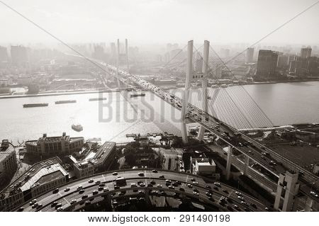 Shanghai Nanpu Bridge over Huangpu River with busy traffic in China.