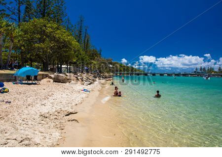 Gold Coast, AUS - JAN 12 2019: People enjoying beach activities at famous family beach at Tallebudgera Creek  Gold Coast, Queensland, Australia