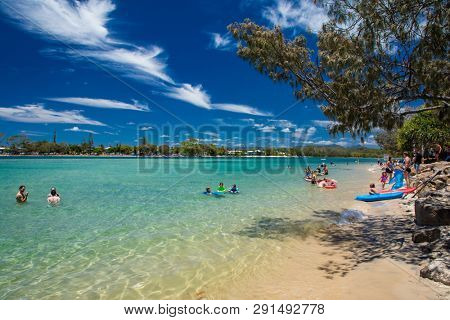 Gold Coast, AUS - JAN 12 2019: People enjoying beach activities at famous family beach at Tallebudgera Creek  Gold Coast, Queensland, Australia