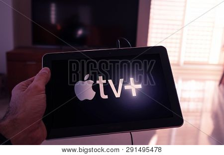 Barcelona, Spain. March 2019: Man Holds A Tablet With The New Apple Tv Plus On Screen
