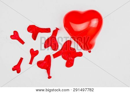 Red blown up heart shaped balloon