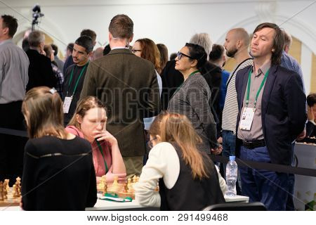 ST. PETERSBURG, RUSSIA - DECEMBER 28, 2018: Grandmaster Gata Kamsky, USA (right) watches women compete in the final round of King Salman World Rapid Chess Championship 2018