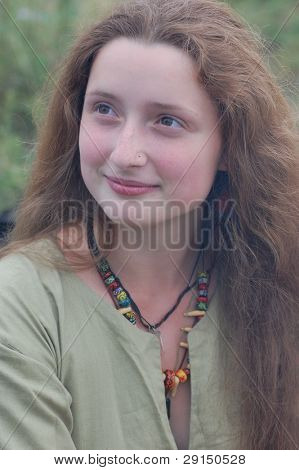 KIEV, UKRAINE - JULY 31: Member of history club Golden Capricorn wears medieval costume as she participates in historical festival in memory of King Vladimir July 31, 2009 in Kiev, Ukraine.