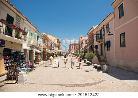 Santa Teresa Gallura, Sardinia, Italy - July 9, 2018: Street Shop and Cafe with Tourists in Santa Teresa Gallura City, Sardinia, Italy.