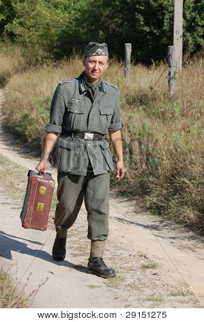 KIEV, UKRAINE - SEPT 19, : Member of a history club wear historical German uniforms as he participates in a WWII reenactment.Buttle for Kiev in 1943. September 19 , 2009 in Kiev, Ukraine