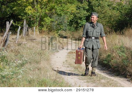 KIEV, UKRAINE - SEPT 19, : Member of a history club wear historical German uniforms as he participates in a WWII reenactment.Buttle for Kiev in 1943. September 19 , 2009 in Kiev, Ukraine
