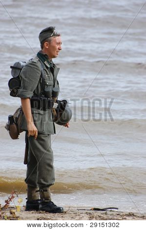 KIEV, UKRAINE - SEPT 19, : Member of a history club wear historical German uniforms as he participates in a WWII reenactment.Buttle for Kiev in 1943. September 19 , 2009 in Kiev, Ukraine