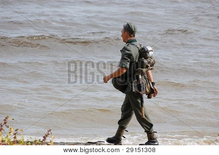 KIEV, UKRAINE - SEPT 19, : Member of a history club wear historical German uniforms as he participates in a WWII reenactment.Buttle for Kiev in 1943. September 19 , 2009 in Kiev, Ukraine