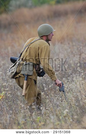 KIEV, UKRAINE - SEPT 19, : Member of a history club wear historical Soviet  uniforms as he participates in a WWII reenactment.Buttle for Kiev in 1943. September 19 , 2009 in Kiev, Ukraine
