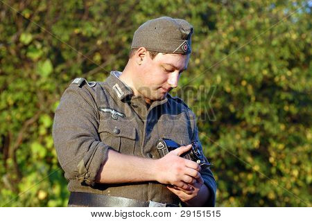 KIEV, UKRAINE - SEPT 19, : Member of a history club wear historical German uniforms as he participates in a WWII reenactment.Buttle for Kiev in 1943. September 19 , 2009 in Kiev, Ukraine