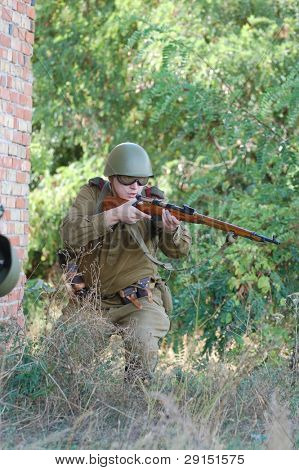 KIEV, UKRAINE - SEPT 19, : Member of a history club wear historical Soviet  uniforms as he participates in a WWII reenactment.Buttle for Kiev in 1943. September 19 , 2009 in Kiev, Ukraine