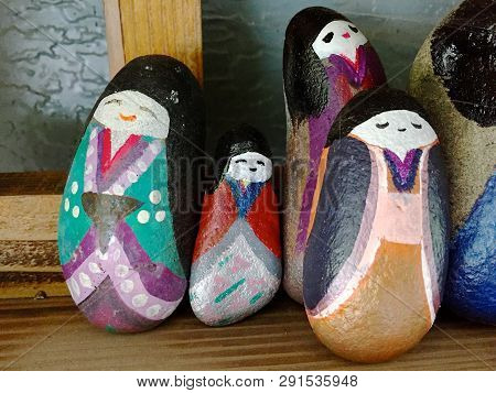 Close Up Picture Of Some Beautifully Painted Stone Figures Located Displayed In Front Of A Store In 