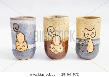Three Ceramic Stone Jugs With White Background