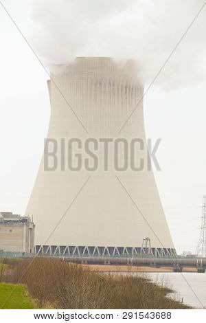 May 2016, Doel, Antwerp, Belgium, Cooling Towers Of The Nucleair Power Plant In Doel Next To The Riv