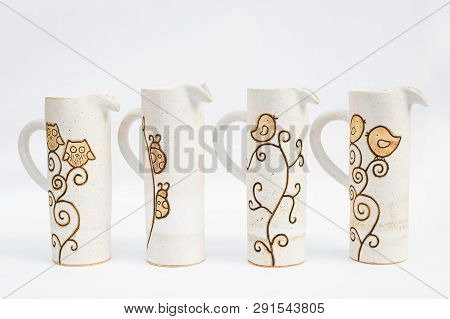 Four Stoneware Ceramic Jugs With White Background